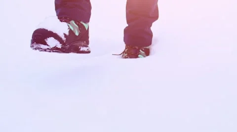 Legs in Winter Boots Walking through Thick Snow. STABILIZED SLOW MOTION 120fps. Video stock 68828179