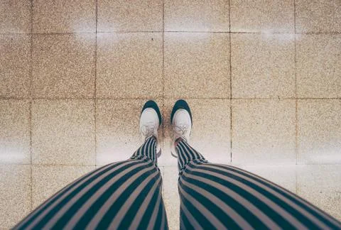 Legs of a woman waiting in the subway car Stock Photos