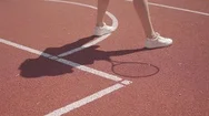 Legs Of Woman In White Sneakers Doing Warm-Up Before Playing Tennis On The Court Stock Footage
