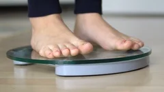 Women stand on electronic scales with measuring cables requiring weight  control. Woman foot stepping on weigh scales with tape measure. Diet  Concept 17154858 Stock Photo at Vecteezy