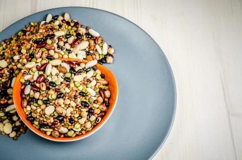 Legumes in a dish on table, close up, background.. Stock Photos
