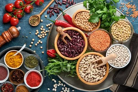 Legumes, lentils, chickpea, beans assortment, tasty appetizing ingredients sp Stock Photos