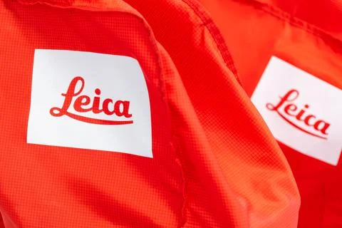 Leica logo on the red microscope case. Production of optics products for Stock Photos