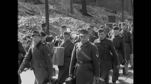 LEIPZIG - 1945 - German prisoners of war are marched through the streets of Video stock 296690987