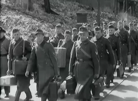 LEIPZIG - 1945: Liberated prisoners — Column walks a tree-lined street Stock Footage 342919602