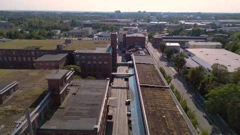 Leipzig cotton spinning mill brick buildings Dramatic aerial view flight drone Video stock 283845926
