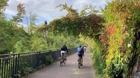 Leipzig, Germany, 09-28-2023 cyclists on the Karl-Heine-Kanal way Stock Footage 265979686