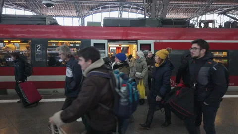 Leipzig, Germany - 11/23/2023: Large crowd of commuters rushing through Stock Footage 258654635
