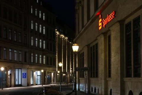 Leipzig, Germany, May 3, 2026: Empty city street at night featuring illuminat Stock Photos