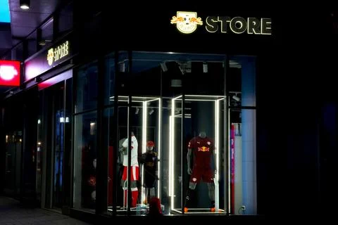 Leipzig, Germany, May 3, 2026: Nighttime View of Sports Apparel Storefront .. Stock Photos