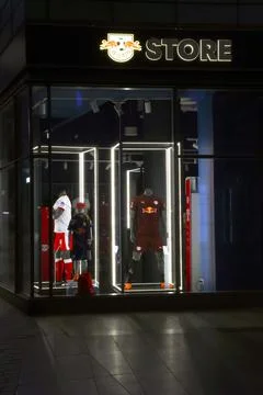 Leipzig, Germany, May 3, 2026: Sports Apparel Storefront with Illuminated F.. Stock Photos