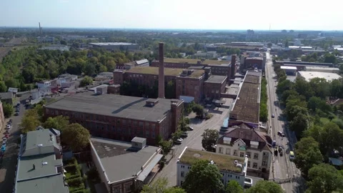 Leipzig spinning mill brick buildings chimney. Fantastic aerial view drone Stock Footage 283870149
