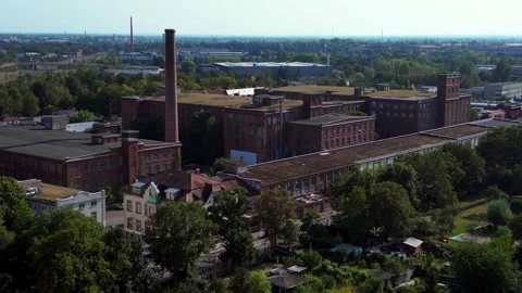 Leipzig spinning mill brick buildings chimney. Majestic aerial view flight drone Stock Footage 283870262