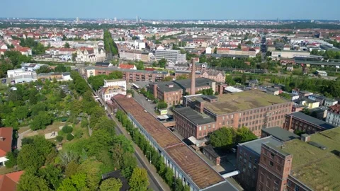 Leipzig spinning mill brick buildings chimney. Magic aerial view flight drone Stock Footage 283870326