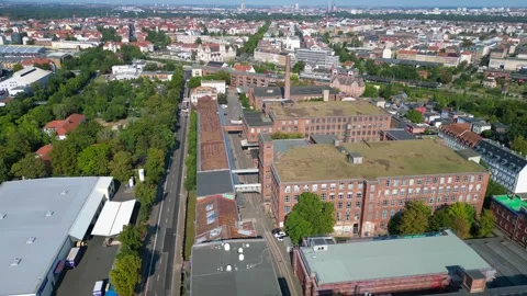 Leipzig spinning mill brick buildings chimney. Lovely aerial view flight drone Stock Footage 283870360