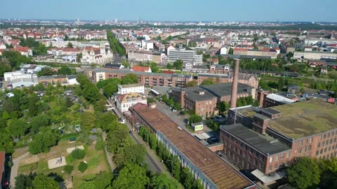 Leipzig spinning mill brick buildings chimney. Best aerial view flight drone Stock Footage 283870381
