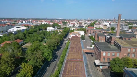 Leipzig spinning mill brick buildings chimney. Dramatic aerial view flight drone Video stock 283870401