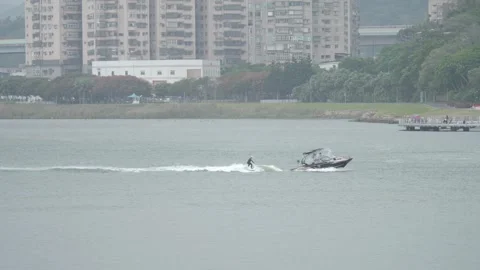 Leisure Activity, Water Skiing Behind Boat on Tamsui River, Taiwan, Wide shot Видео 277258393
