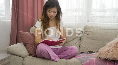 Leisure pastime teenage girl relax home writing Stock Photos