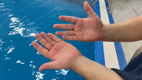 Leisurely Hands Reaching Poolside Stock Footage 305273837