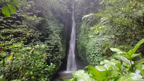 Leke Leke Waterfall in Bali with Subtle Upward Camera Motion – 4K Stock Footage 312867428
