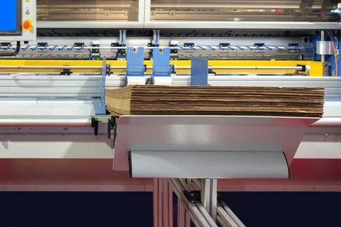 Lements of corton boxes are collected in stack. Conveyor line for the product Stock Photos