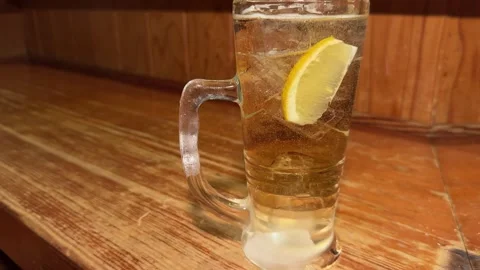 Lemon Added to a Whisky Highball Drink as Bubbles Rise, Japan Stock Footage 345503071