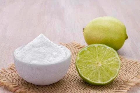 Lemon and baking soda on the table Stock Photos