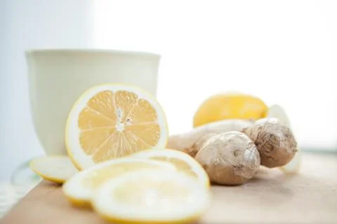 Lemon and ginger with cup on the table Stock Photos