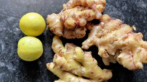 Lemon and Ginger Placed Together on a Plate Видео 320387138