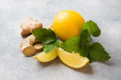Lemon and ginger root on grey background with copy space. Ingredients for a.. 스톡 사진