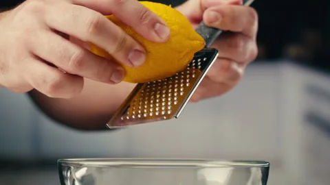 Lemon And Grater, Macro Close Up Shot of a Professional Chef Grating Lemon Zest Stock Footage 309629691