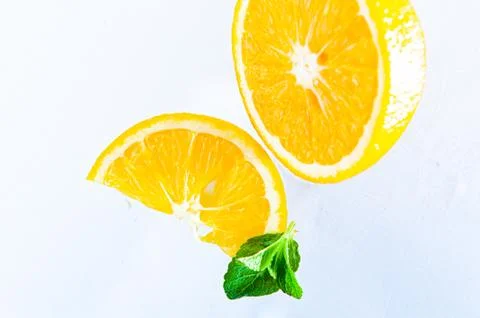 Lemon and mint on a light background top view Photos