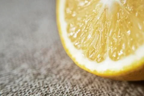 Lemon on the background of the canvas in the rustic style. Place for text Stock Photos