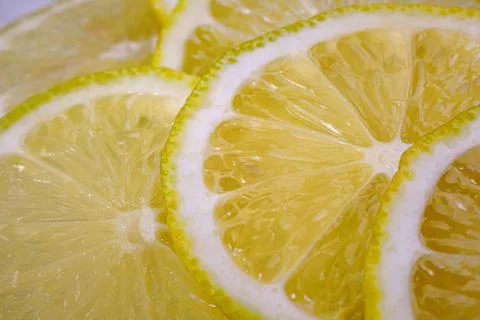 Lemon background. Close up view of lemon slices. Citrus texture. Stock Photos