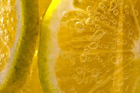 Lemon background. Close up view of lemon slices. Citrus texture. Stock Photos