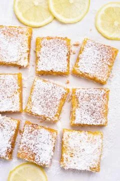 Lemon bars over baking paper, top view Stock Photos