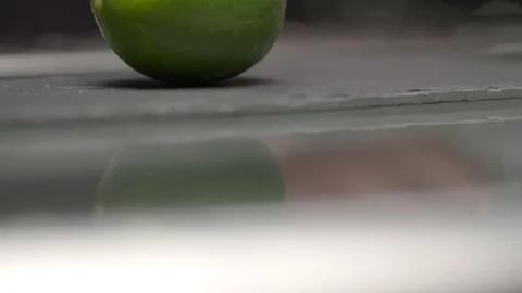 Lemon being cut into half Stock Footage 73682783