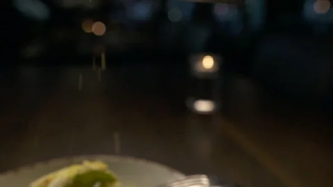 Lemon being shaved over salad  Stock Footage 112660465