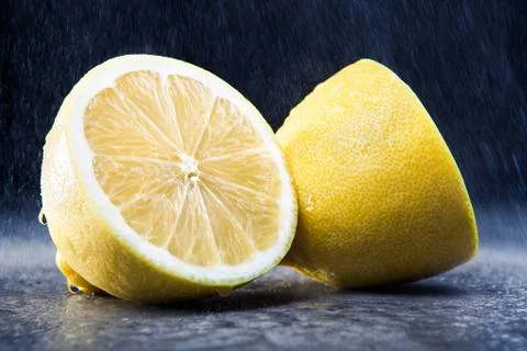Lemon on the black background Stock Photos