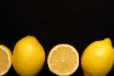 Lemon on a black background Stock Photos