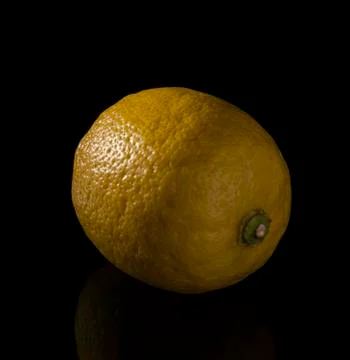 Lemon on black background Stock Photos