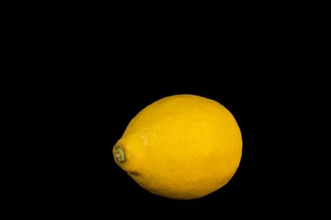 Lemon on the black background Stock Photos