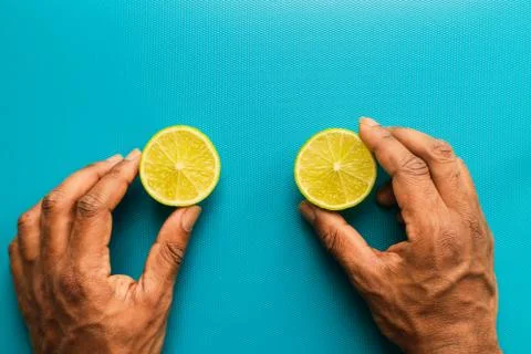 Lemon on a blue background Stock Photos