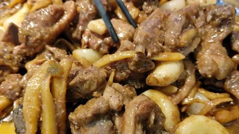 Lemon Braised Duck Meat with Garlic, Chopsticks Taking a Piece Stock-Footage 334225090