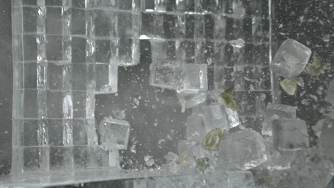 Lemon Breaks Ice with Explosion in Black Background in Slow Motion  High Speed Stock Footage 86320552