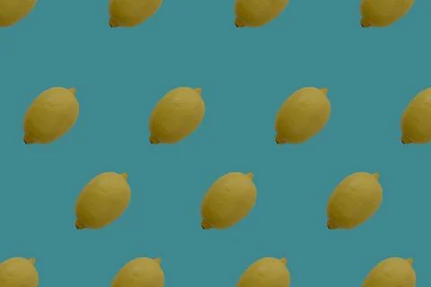 Lemon on a bright turquoise blue background. Seamless pettern. Summer patte.. Stock Photos