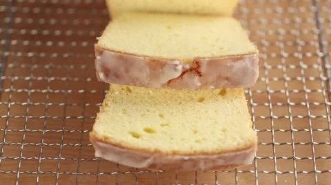 Lemon cake with a piece removed Stock Footage 24657179