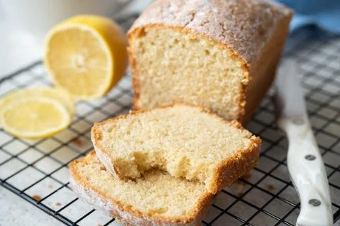 Lemon cake slice missing a bite Stock Photos