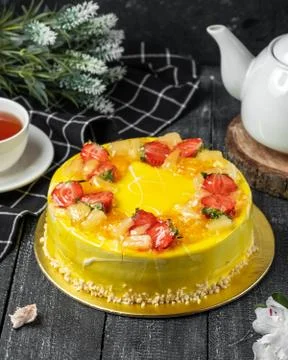 Lemon cake with strawberries on the table Stock Photos